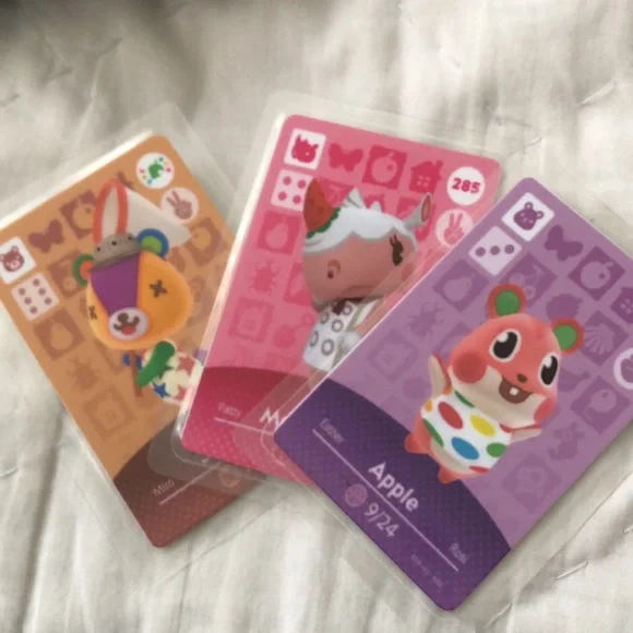 Nintendo Switch Lite with 3 games, 3 characters for Animal Crossing, and case.